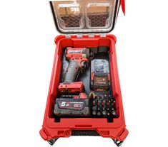 a red tool box filled with tools on top of a white background