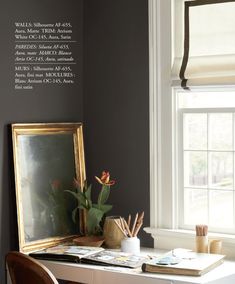 a white desk topped with a mirror and a potted plant next to a window