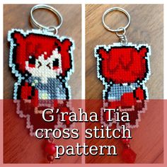 an image of a cross stitch keychain that is made to look like a red fox