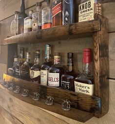 a wooden shelf holding several bottles of liquor