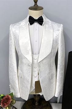 a white tuxedo jacket with a black bow tie