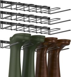 four different types of boots hanging on a rack