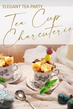 two tea cups filled with desserts on top of a table