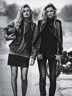 two beautiful young women walking down the street