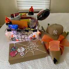 a baseball hat and other items on a bed