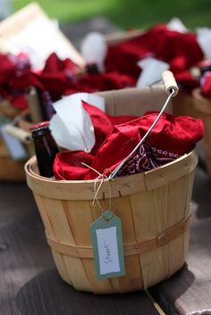 baskets filled with red and white items sitting on top of a wooden table