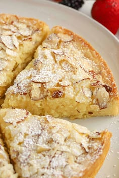 several pieces of pie on a plate with strawberries in the backgroung