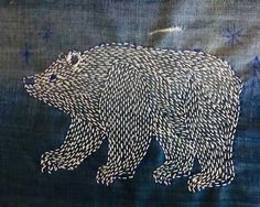 a drawing of a bear on blue fabric