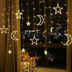 the window is decorated with stars and moon lights