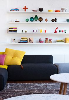 a living room filled with furniture and decor