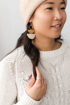 Cozy vibes in one of our best selling earrings shapes! This beige leather is soft, neutral and perfect for a delicate statement. •••••••••••••••••••••••••••••••••••••••••••••••••••••••••••••• • ORDERING • These leather earrings measure approx 1 1/2" wide, 2 3/4" drop with hook. These earrings come with raw brass or 14K gold fill hooks, and feature raw brass accents. Please note raw brass will naturally oxidize over time, creating a beautiful vintage like patina on your earrings. Each pair of ear Handmade Minimalist Beige Jewelry, Minimalist Handmade Beige Jewelry, Chic Handmade Beige Earrings, Chic Beige Handmade Earrings, Minimalist Everyday Cream Jewelry, Everyday Minimalist Cream Jewelry, Chic Brown Earrings For Everyday Wear, Chic Beige Dangle Jewelry, Trendy Beige Drop Earrings