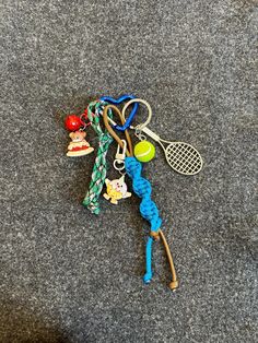 a tennis racquet and some toys on the ground