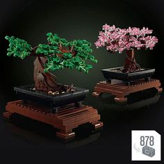 two bonsai trees with pink flowers are shown in front of a black background and the bottom one is made out of legos