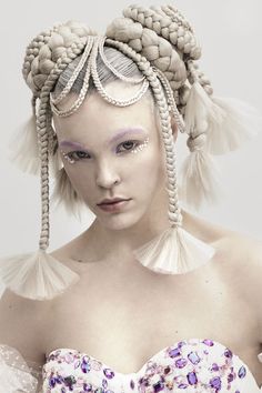 Slick back hair with space bun braids and intricate plaits on the models head and face Space Bun Hairstyles, Futuristic Hair, Space Bun, Dramatic Hair, Editorial Hair, Slicked Back Hair