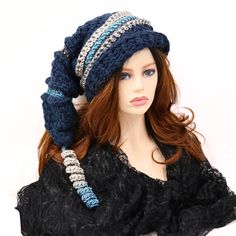 "Make winter fun with this chunky thick warm mountain ski snow hat. A little witchy, a bit of elf, and dark blue in color. I've crocheted this with bands of contrasting color and ridges. 21\" long from the top to the brim with a matching corkscrew tip, this hat is soft and can be shaped, tucked, or worn straight out. Certain to add character to your outdoor wear or gift to a friend who just loves fun things. Lots of stretch, so one size will fit most. Machine wash cold, lay flat to dry." Winter Brimmed Hat One Size, One-size Winter Brimmed Hats, One Size Winter Brimmed Hat, Witchy Wide Brim Hat For Winter, Witchy Wide Brim Winter Costume Hat, Witchy Wide Brim Costume Hat For Winter, Witchy Brimmed Winter Costume Hats And Headpieces, Witchy Brimmed Winter Hats, Witchy Adjustable Winter Hats