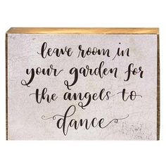 a sign that says leave room in your garden for the angels to dance on it