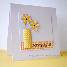 a birthday card with yellow flowers in a vase