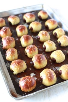 a baking pan filled with hot cross buns