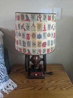 a lamp sitting on top of a wooden table