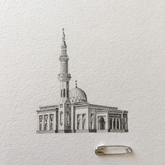 a drawing of a building with a steeple on it's side and a paper clip in front of it