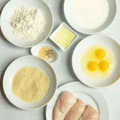 the ingredients are laid out on the table to be used in this recipe, including eggs, flour, and butter