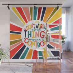 a wall mural with the words don't worry about things you can't control