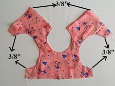 the back of a child's pink top with princesses on it and measurements