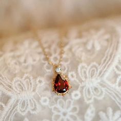 Elegant Water Drop Ruby Necklace Immerse yourself in the enchanting energy of our Elegant Water Drop Ruby Necklace. This exquisite piece is more than just a beautiful accessory; it is a powerful tool for emotional healing and personal transformation. Key Features: Side Stone: Crystal - enhances your emotional wellbeing and promotes clarity. Shape/Pattern: Water Drop - symbolizes fluidity and grace, allowing your inner beauty to shine. Chain Type: Box Chain - sturdy yet elegant, ensuring that the Engagement Necklaces, Ruby Necklace Pendant, Necklace Chain Types, Wedding Party Accessories, Purple Necklace, Ruby Necklace, Necklace Brands, Animal Earrings, Jade Ring