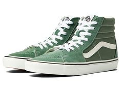 Vans SK8-Hi - Skate Shoes : Color Theory Duck Green : Keep it old school every step of the way with the classic Vans SK8-Hi skateboard shoes! High-top skate shoes with a classic silhouette and Sidestrap detail. Uppers of suede, leather, or canvas. Cotton drill lining. Padded collar for added comfort and support. Triple-stitch collar adorns collar. Die-cut EVA insert. Vulcanized construction: • Slimmed-down profile offers a flexible feel. • Gum rubber outsole with signature waffle tread provides Classic Lace-up High-top Sneakers For Skateboarding, Vans Suede Casual Sneakers, Casual Suede Vans Sneakers, Green Skate Shoes With Speckled Midsole, Vans Suede Skate Shoes With Laces, Green Suede Skate Shoes For Streetwear, Green Leather Skate Shoes For Skateboarding, Sporty Suede Vans Skate Shoes, Green Leather Skate Shoes