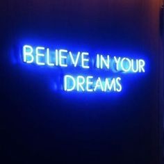 a neon sign that says believe in your dreams