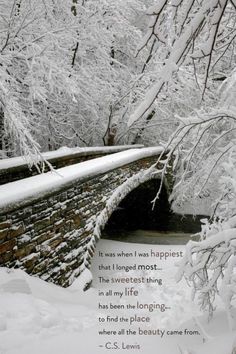 a bridge that is covered in snow and has a poem written on the side of it