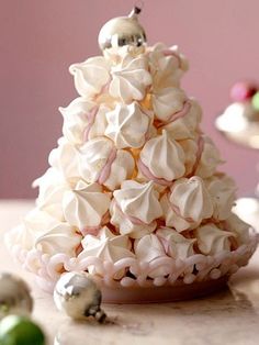 there is a small christmas tree made out of marshmallows on the table