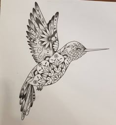 a black and white drawing of a hummingbird with flowers on it's wings