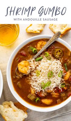 shrimp gumbo with andoullie sausage in a white bowl next to toasted bread