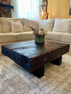 a wooden table sitting in front of a couch