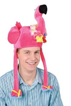 a man wearing a pink flamingo hat with flowers on it's head and smiling at the camera