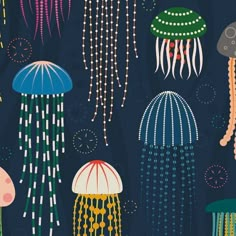 an image of jellyfishs in the dark blue sea with beads on their tails