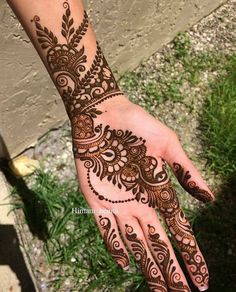 henna tattoo on the palm of someone's hand