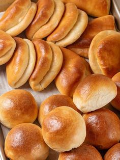 bread rolls in a baking pan ready to be baked into buns for dinner or as an appetizer