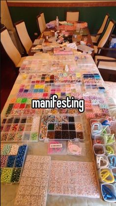 many different types of beads on a table with the words manifesting over it