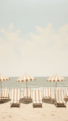 several lounge chairs and umbrellas on the beach