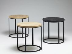 three round tables with metal bases and wood tops, all in different sizes on a white background