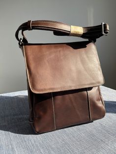 men's shoulder bag in brown leather, handcrafted. Modern Brown Saddle Bag Satchel, Brown Crossbody Briefcase With Adjustable Strap, Everyday Brown Flap Bag With Smooth Grain, Everyday Brown Smooth Grain Flap Bag, Brown Leather Hobo Shoulder Bag, Brown Leather Crossbody Backpack For Everyday, Brown Luxury Saddle Shoulder Bag For Business, Brown Leather Saddle Shoulder Bag, Formal Brown Saddle Bag With Leather Handles