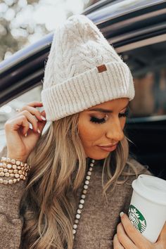 Feel the warmth of the season with this soft beanie in stone featuring a stretchy and textured cable knit material and a ribbed rolled silhouette! Cozy Cream Knit Hats, Cream Beanie For Cold Weather In Fall, Fall Cable Knit Beanie For Cold Weather, Beige Knit Beanie, Cozy Cream Beanie For Fall, Cozy Cream Soft Knit Hat, Cozy Beige Beanie, Beige Knit Beanie For Cold Weather, Cream Knit Hat For Fall