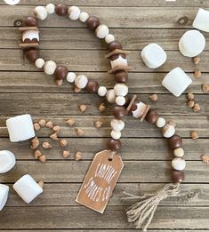 some marshmallows and other items on a wooden table with a price tag