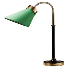 a green lamp with a black base and a gold arm on an isolated white background