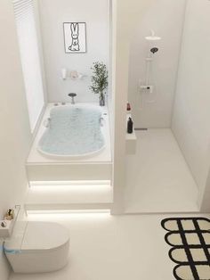 a bathroom with a bathtub and toilet in it