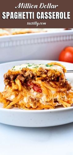 a white plate topped with lasagna casserole covered in cheese and meat