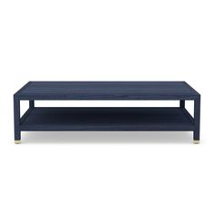 a blue coffee table sitting on top of a white floor next to a black shelf