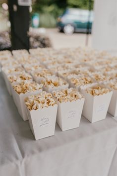 there are many bags of popcorn on the table